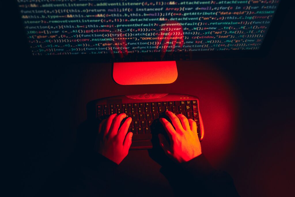 Man using computer maliciously to break code